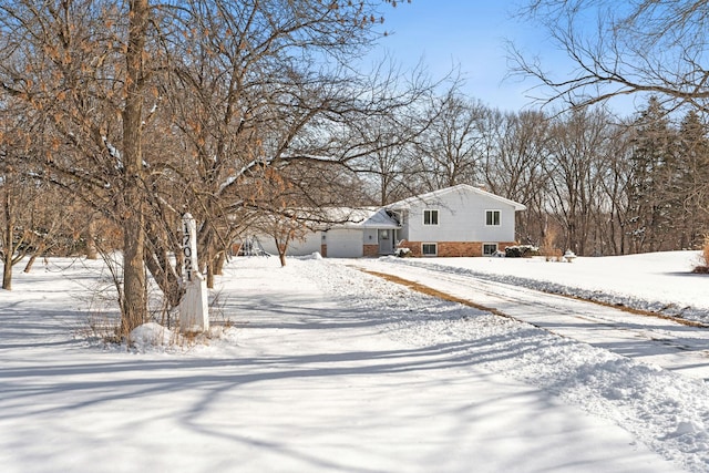 view of front of home with driveway and an attached garage