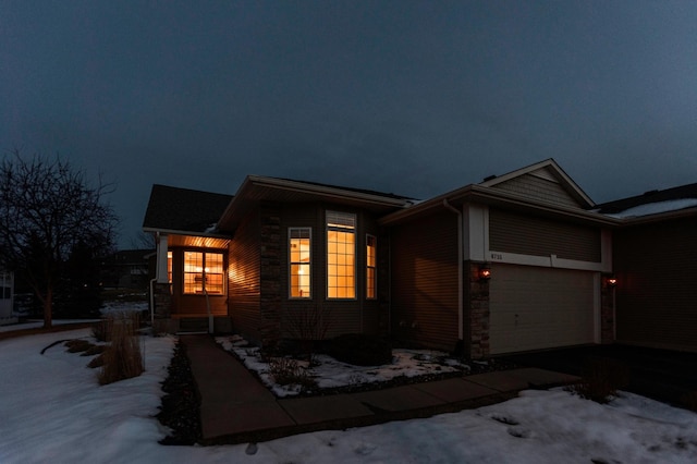 view of front of house with a garage and driveway