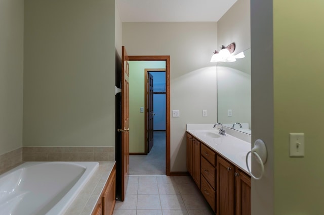 full bath with a garden tub, a sink, baseboards, tile patterned floors, and double vanity