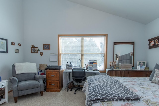 bedroom featuring high vaulted ceiling and light colored carpet