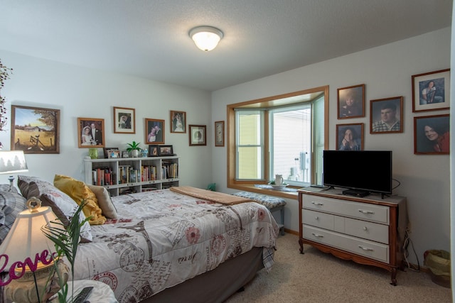 bedroom featuring light colored carpet