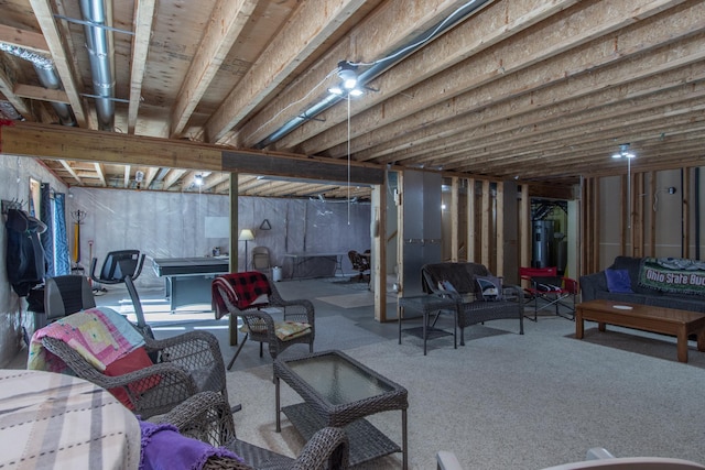 unfinished basement featuring carpet and water heater