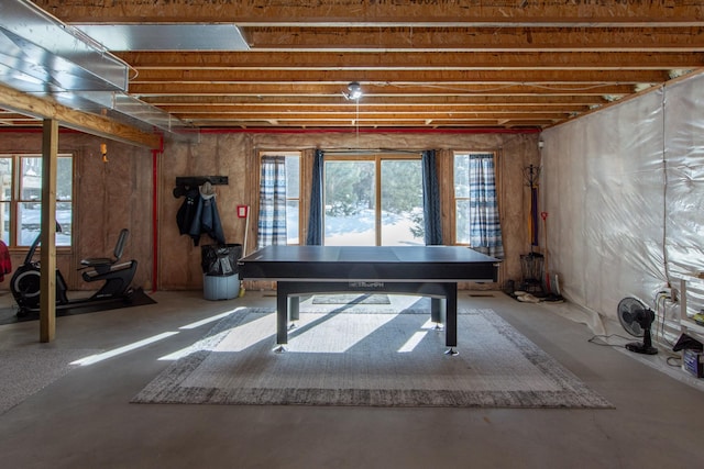 recreation room featuring concrete flooring