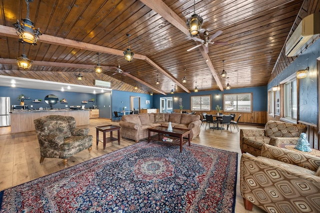 living room featuring lofted ceiling with beams, a wall mounted AC, hardwood / wood-style floors, and ceiling fan