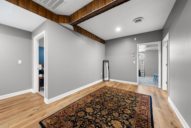 hallway with light wood-type flooring