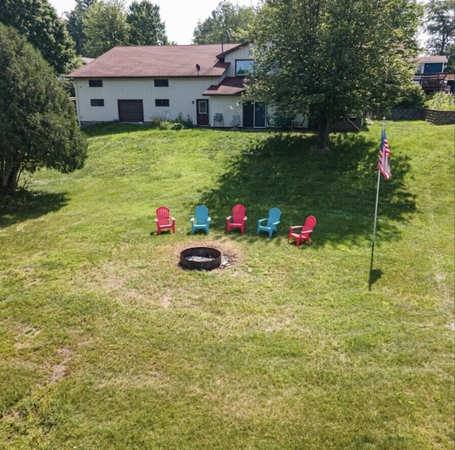 view of yard with a fire pit