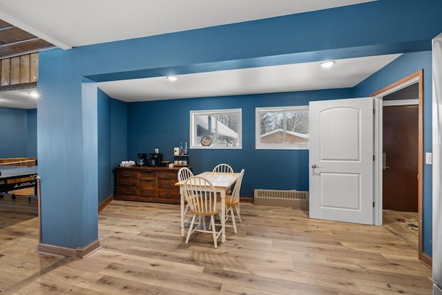 dining room with wood-type flooring, baseboards, and recessed lighting