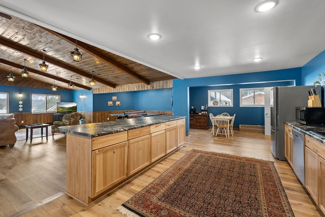 kitchen with stainless steel appliances, dark countertops, beamed ceiling, and light wood finished floors