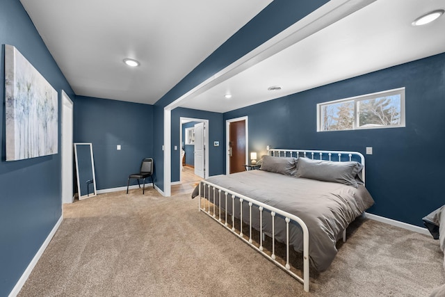 bedroom with carpet flooring and baseboards