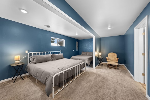 carpeted bedroom with visible vents and baseboards