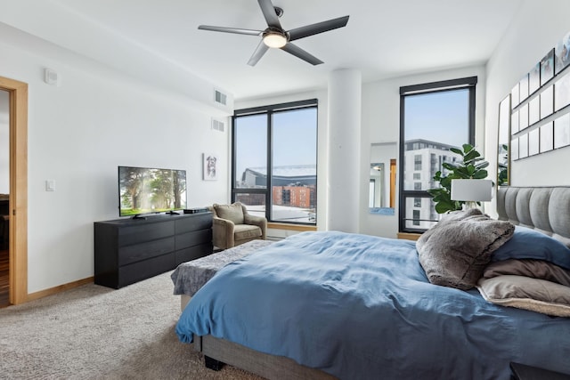 1240 2nd St Unit 704, Minneapolis, MN 55415 - carpeted bedroom featuring access to outside, multiple windows, baseboards, and ceiling fan