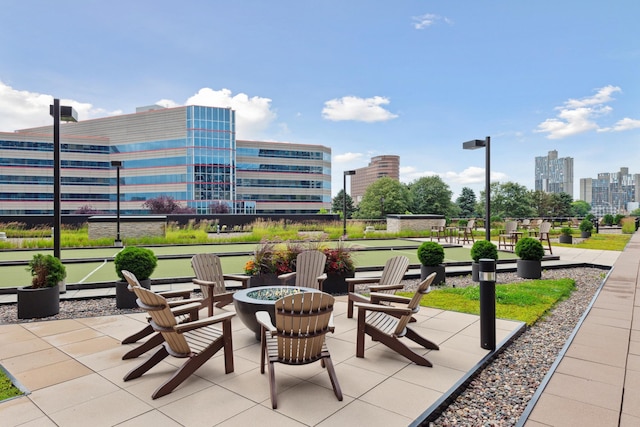 1240 2nd St Unit 704, Minneapolis, MN 55415 - view of patio / terrace featuring a city view and a bocce ball area