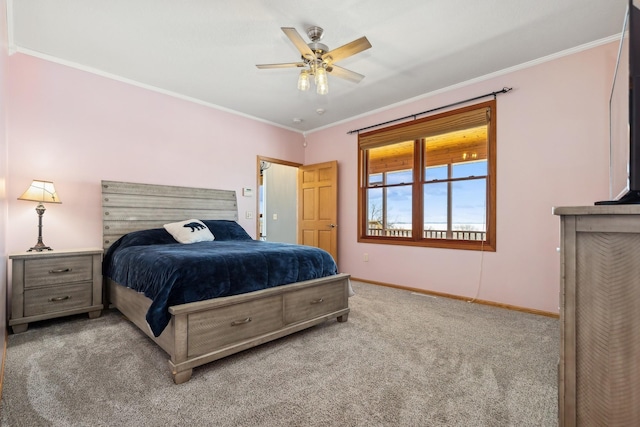 carpeted bedroom featuring baseboards, ceiling fan, and crown molding