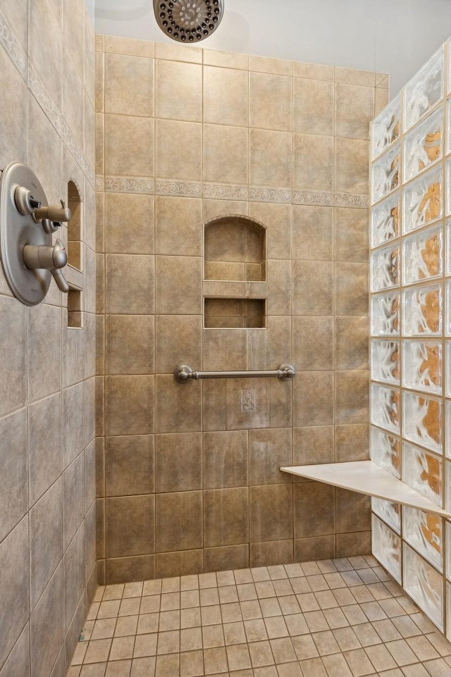 full bath featuring tiled shower