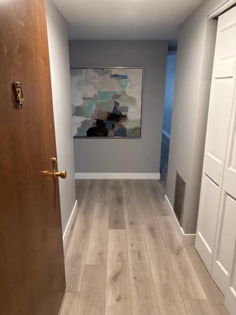 hallway featuring light hardwood / wood-style flooring