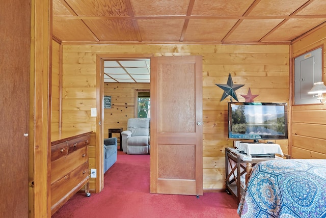 carpeted bedroom featuring wooden walls