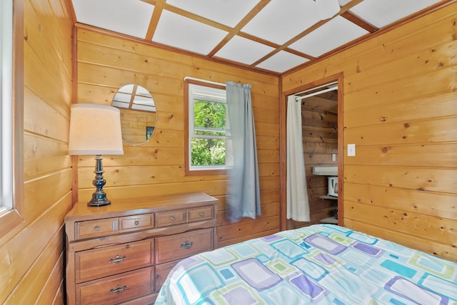 bedroom with wooden walls