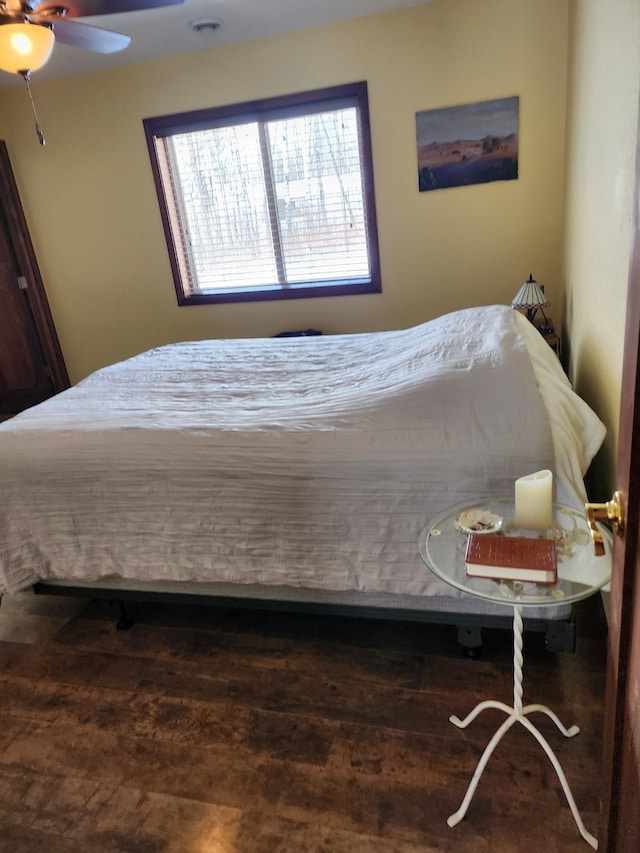 bedroom with a ceiling fan and wood finished floors