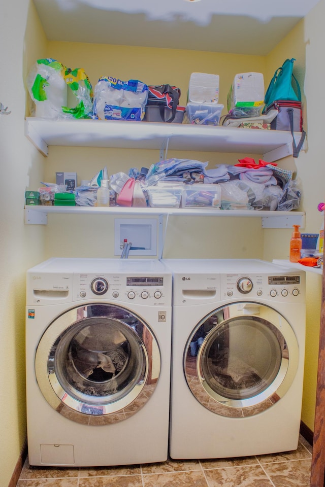 washroom featuring laundry area and washer and dryer