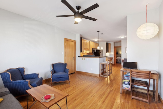2701 Harriet Ave Unit 200, Minneapolis, MN 55408 - living area featuring ceiling fan, light wood-type flooring, and baseboards