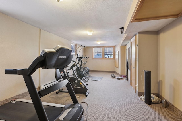 2701 Harriet Ave Unit 200, Minneapolis, MN 55408 - exercise area featuring baseboards, carpet floors, and a textured ceiling