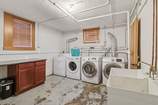 2701 Harriet Ave Unit 200, Minneapolis, MN 55408 - laundry area featuring independent washer and dryer and cabinet space