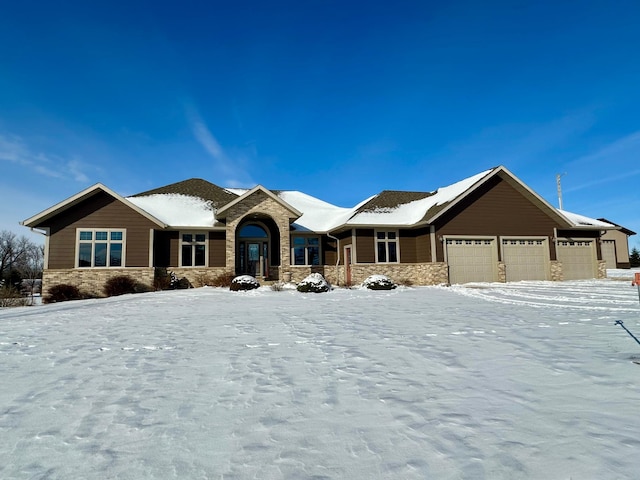 single story home featuring stone siding and an attached garage