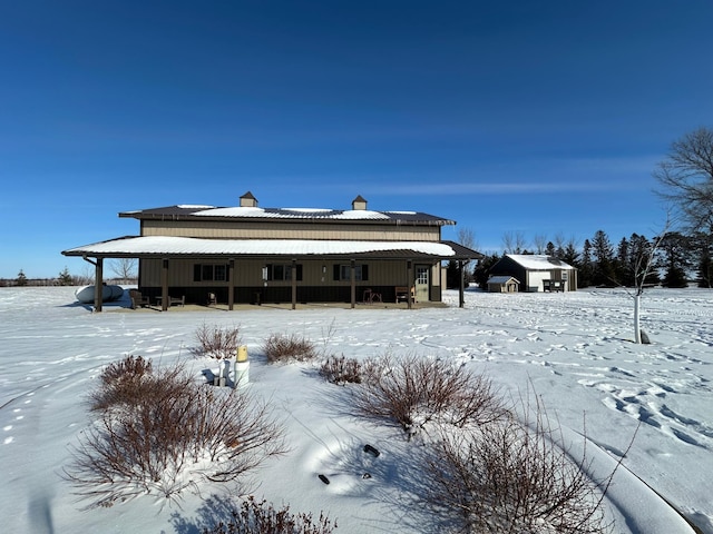 view of snow covered house