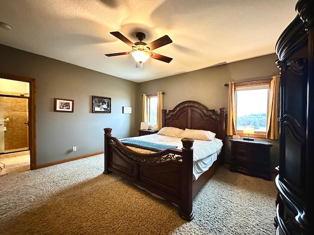 bedroom with light carpet, baseboards, ceiling fan, ensuite bathroom, and a textured ceiling