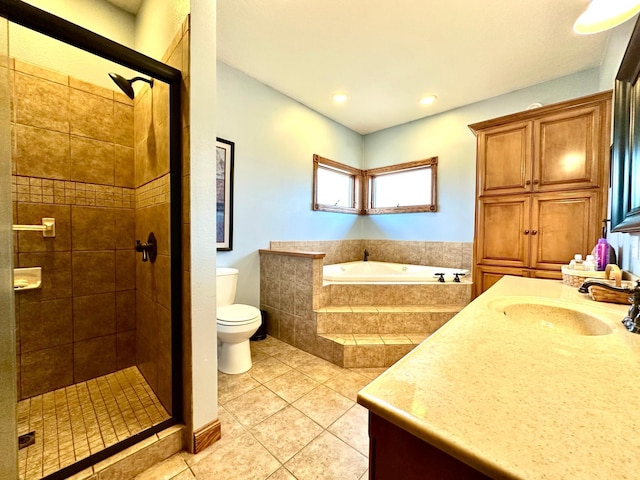 full bath with a stall shower, toilet, tile patterned floors, a garden tub, and vanity