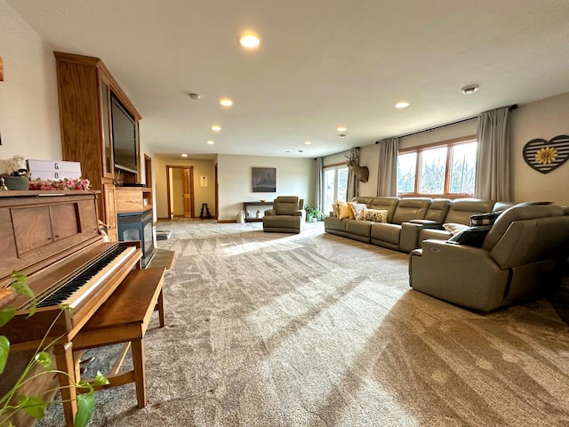 living room with light carpet, a fireplace, and recessed lighting