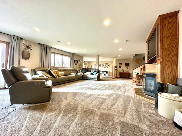 living area with carpet and recessed lighting