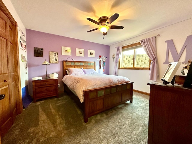 carpeted bedroom featuring a ceiling fan and baseboards