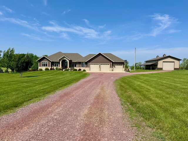 13943 Sundberg Ave, Graham Lakes Twp, MN 56131 - single story home with dirt driveway, a front lawn, and an attached garage