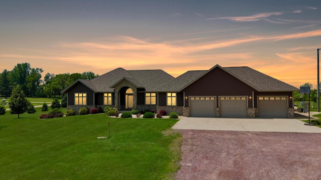 13943 Sundberg Ave, Graham Lakes Twp, MN 56131 - view of front of home featuring stone siding, concrete driveway, a lawn, and a garage