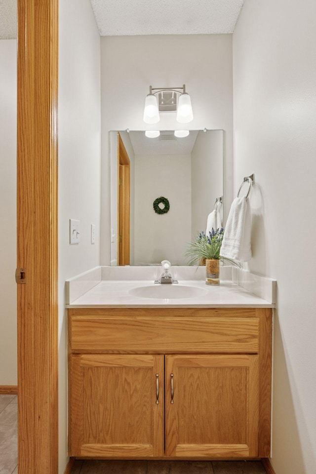 bathroom featuring vanity and baseboards