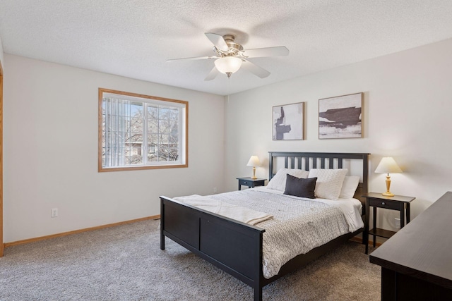 carpeted bedroom featuring a textured ceiling, a ceiling fan, and baseboards