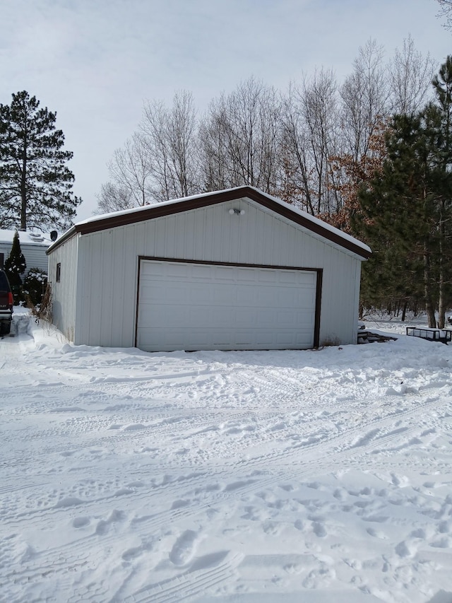 view of snow covered garage