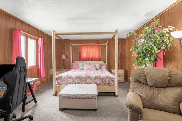 carpeted bedroom featuring wooden walls