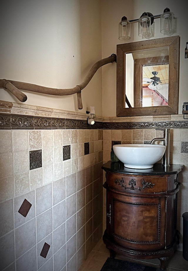 bathroom featuring tile walls and vanity