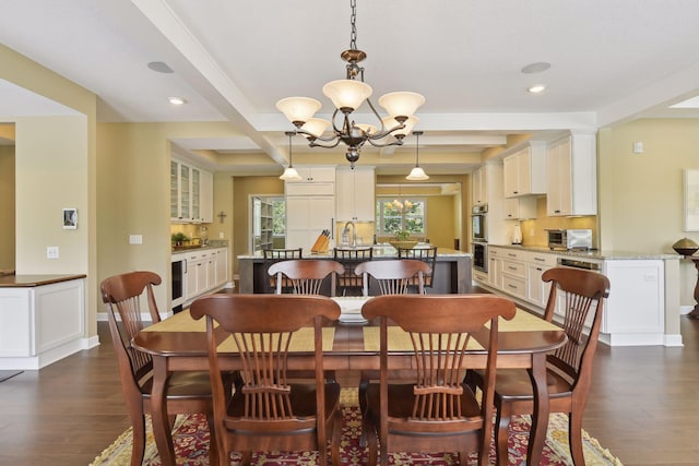 dining room featuring baseboards, dark wood finished floors, wine cooler, a notable chandelier, and beam ceiling