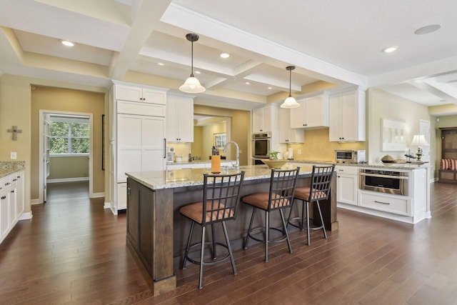 kitchen with dark wood finished floors and white cabinets