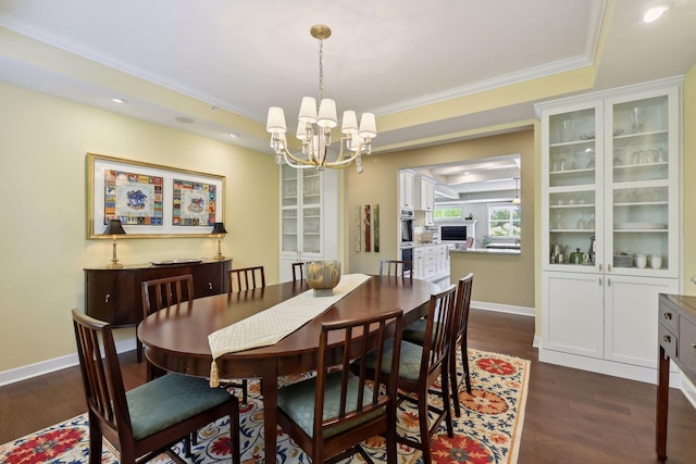 dining space with a chandelier, recessed lighting, baseboards, ornamental molding, and dark wood-style floors