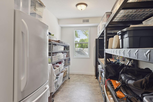 walk in closet featuring visible vents and light floors