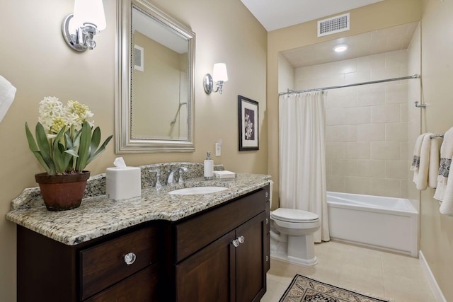 bathroom with visible vents, vanity, toilet, and tile patterned floors