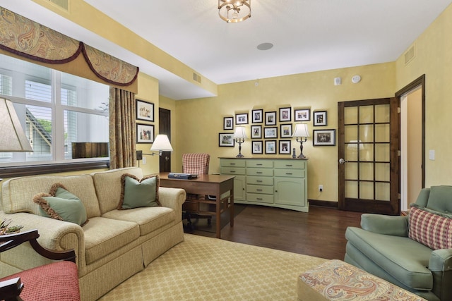 interior space featuring dark wood-style flooring, visible vents, and baseboards