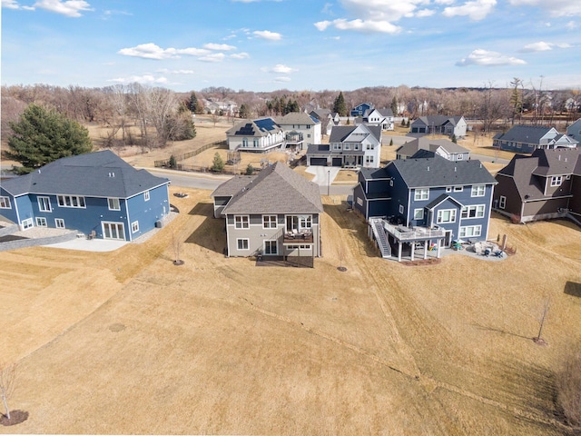 birds eye view of property with a residential view