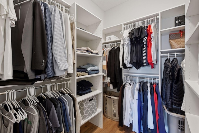 spacious closet with wood finished floors