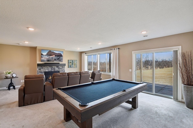 game room featuring billiards, baseboards, carpet, a textured ceiling, and a fireplace