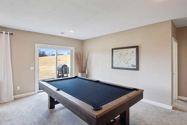 rec room featuring baseboards, pool table, a textured ceiling, and light colored carpet